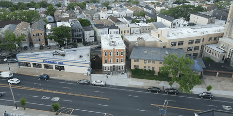 a view from above of a city street and buildings